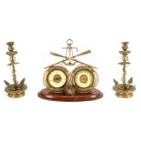 A LATE 19TH CENTURY CLOCK/BAROMETER GARNITURE OF MARITIME INTEREST the brass case surmounted by a