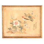 A 19TH CENTURY CHINESE WATERCOLOUR ON SILK depicting a singing bird perched amidst blossoming