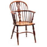 AN EARLY 19TH CENTURY NOTTINGHAMSHIRE YEW-WOOD LOW BACK WINDSOR CHAIR with hooped top rail and