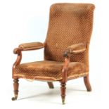 A REGENCY MAHOGANY UPHOLSTERED LIBRARY CHAIR with shaped back and open arms having scroll shaped