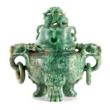 A CHINESE MOTTLED JADE KORO AND COVER surmounted by an entwined dragon on a domed lid with three