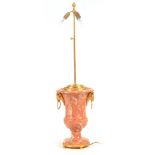 A 20TH CENTURY FRENCH MARBLE AND GILT BRASS TABLE LAMP with urn-shaped body and rams head side