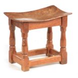 AN EARLY ROBERT 'MOUSEMAN' THOMPSON BURR OAK JOINT STOOL of superb colour and patina with dished