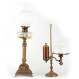 A VICTORIAN ORNATE CAST BRASS OIL LAMP with square footed pierced base, reeded leaf cast stem and