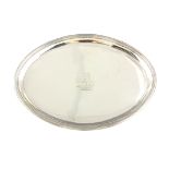 A GEORGE III OVAL MOULDED EDGE SILVER SALVER with dished top and engraved cartouch 22cm wide