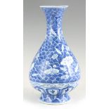 A CHINESE PORCELAIN BLUE AND WHITE VASE with flared neck and shaped rim having floral decoration