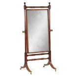 A REGENCY MAHOGANY AND EBONY INLAID CHEVAL MIRROR with swivelling mirror plate having brass