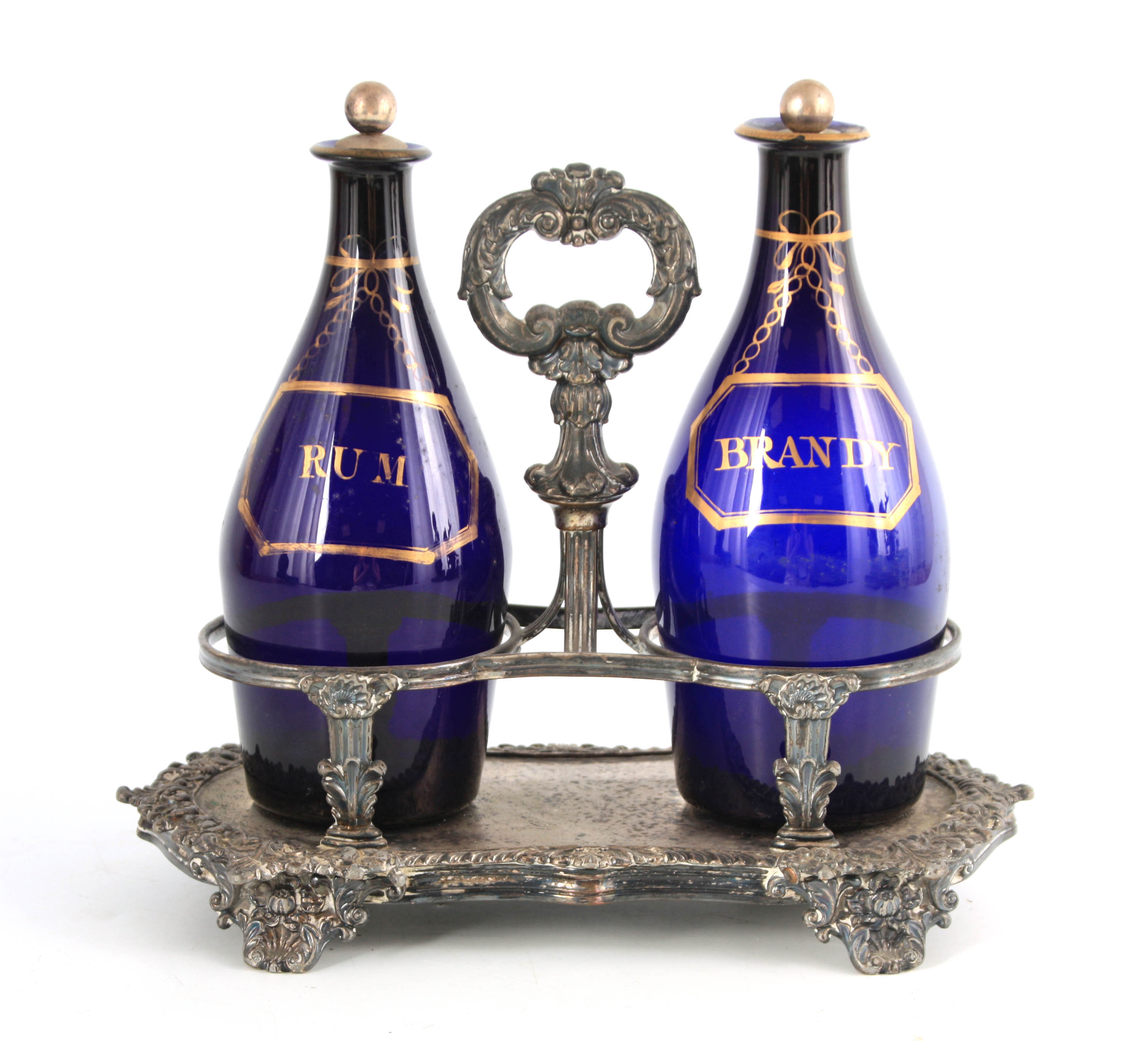 TWO EARLY 19TH CENTURY BRISTOL BLUE DECANTERS FOR RUM AND BRANDY mounted in an old Sheffield plate