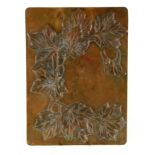 A 1920's CAST BRONZE HANGING PLAQUE with centre hook having high relief decoration of leaves and a