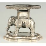 A 19TH CENTURY EUROPEAN SILVER CENTREPIECE STAND depicting a standing Elephant mounted on a