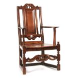 A GOOD LATE 17TH CENTURY JOINED OAK ARMCHAIR OF UNUSUAL DESIGN the single panelled back above joined