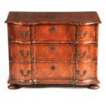 A EARLY 18TH CENTURY DUTCH WALNUT SHAPED FRONT CHEST OF DRAWERS with broad cross-banded top above