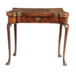 AN UNTOUCHED QUEEN ANNE HERRING-BANDED FIGURED WALNUT CARD TABLE with fold-over top revealing a