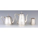 A VICTORIAN BRIGHT CUT ENGRAVED SILVER THREE-PIECE TEA & COFFEE SERVICE of tapering form, the pots