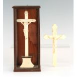 TWO LATE 19TH CENTURY IVORY CORPUS CHRISTI CARVINGS mounted on ivory crosses, one mounted in