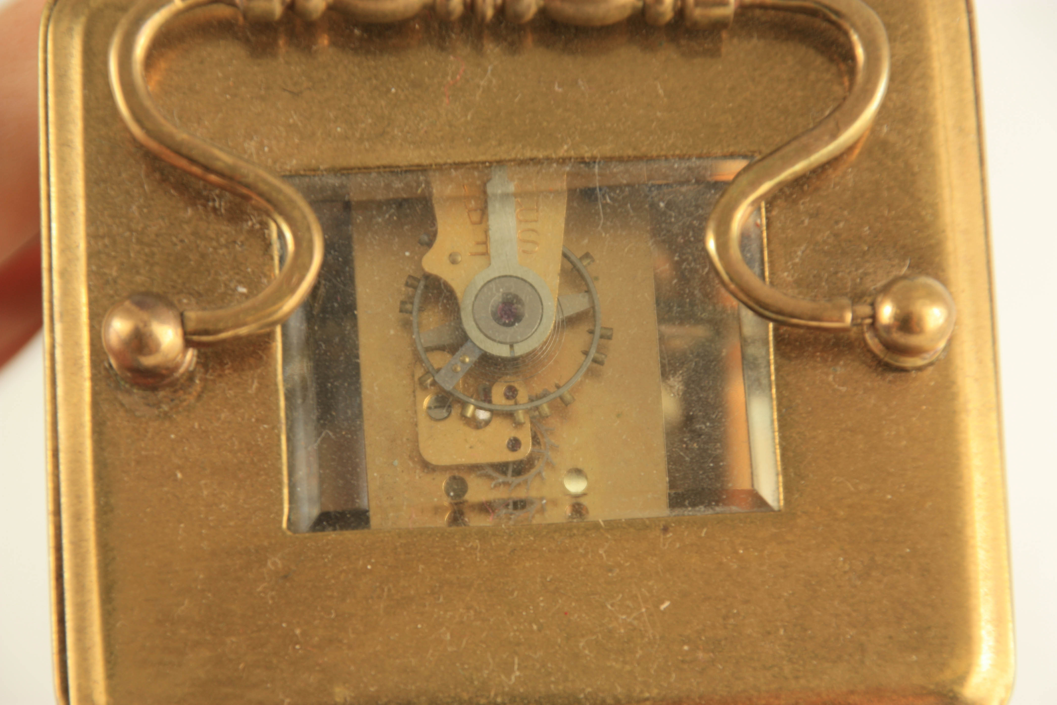 A LATE 19TH CENTURY FRENCH BRASS CASED MANTEL CLOCK having a domed top pediment above a floral - Image 8 of 12