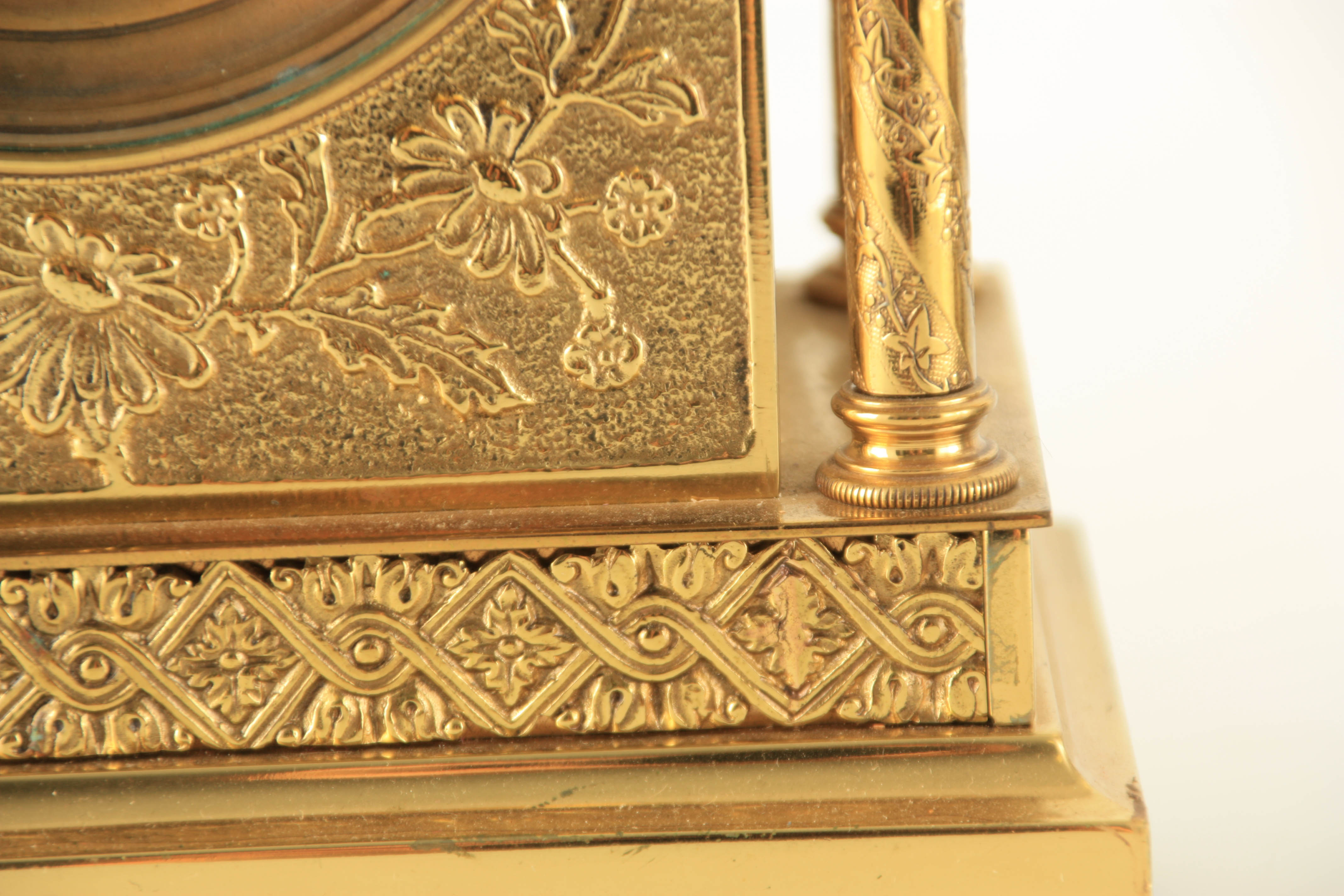 A LATE 19TH CENTURY FRENCH BRASS CASED MANTEL CLOCK having a domed top pediment above a floral - Image 4 of 12