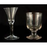 A GEORGIAN PLAIN CLEAR WINE GLASS with flared bowl and teardrop tapering stem on a slightly domed