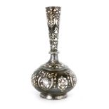 A 19TH CENTURY INDIAN BIDRI VASE having floral silver inlaid decoration on a patinated iron body