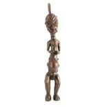 A 19TH CENTURY AFRICAN TRIBLE CARVED WOOD FIGURE OF A MALE 68.5cm high