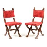 A PAIR OF 19TH CENTURY MAHOGANY HALL CHAIRS with lions mask carved tops above an upholstered back;