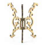 A 19TH CENTURY CHINESE FOLDING BRASS BOWL STAND with shaped frame decorated as serpents 21cm high