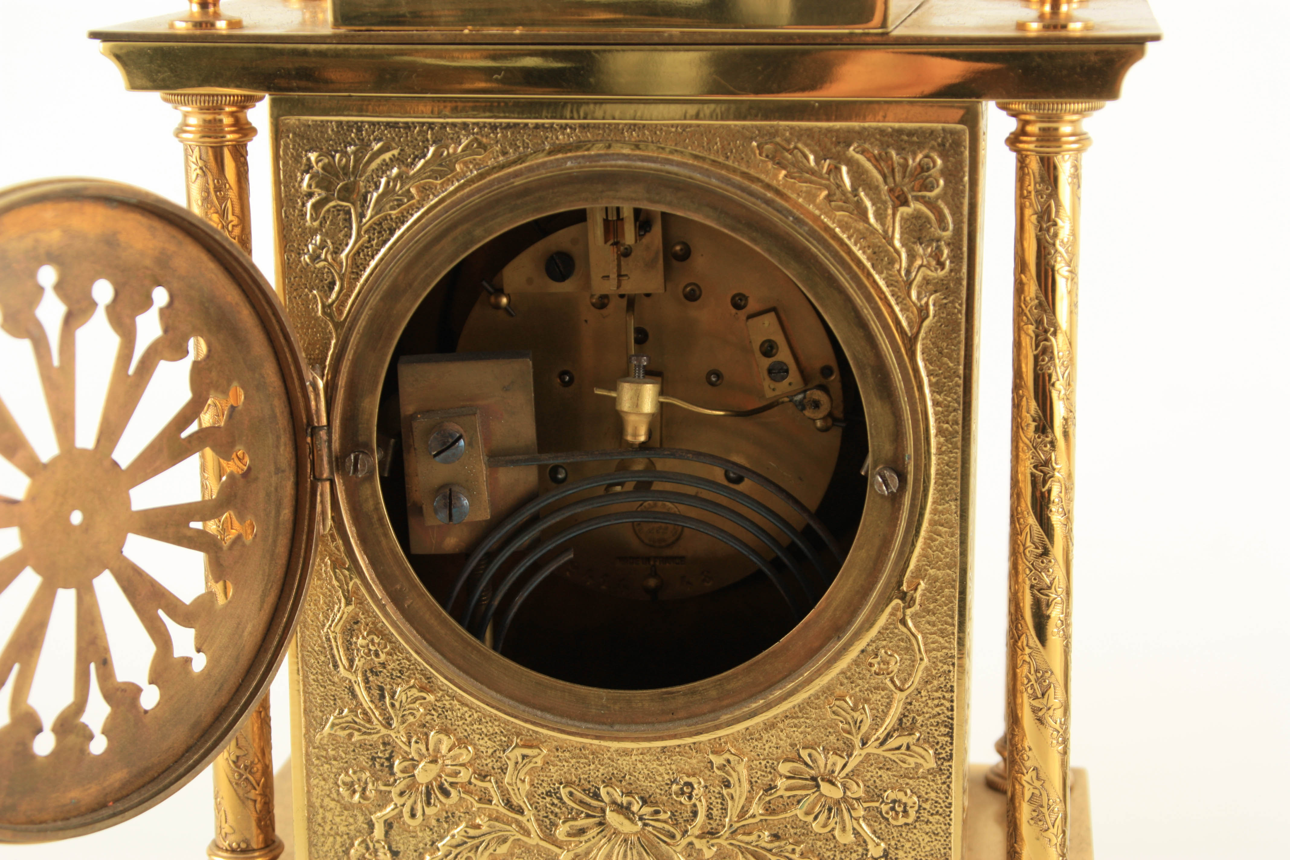 A LATE 19TH CENTURY FRENCH BRASS CASED MANTEL CLOCK having a domed top pediment above a floral - Image 11 of 12