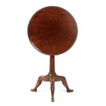 A 19TH CENTURY MAHOGANY MANX TABLE with circular dished top above a birdcage and turned stem;