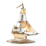 AN UNUSUAL NOVELTY INK STAND FORMED AS A GALLEON constructed from seashells joined by a brass