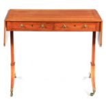 A REGENCY KINGWOOD AND HAREWOOD CROSS-BANDED SOFA TABLE with hinged drop sides above a shallow