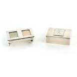 TWO SILVER STAMP BOXES the first of rectangular form with hinged lid having an applied silver one