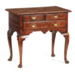A GORGE I CROSSBANDED AND HERRINGBONE STRUNG FIGURED WALNUT LOWBOY OF RICH COLOUR AND PATINA the