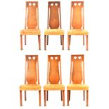 A SET OF SIX ARTS & CRAFTS DINING CHAIRS BY GOODYERS OF LONDON with shaped backrests pierced with