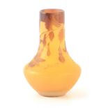 AN ART NOUVEAU GALLE SQUAT GLASS CABINET VASE having dark yellow ground with overlaid sprays of