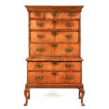 AN EARLY 18TH CENTURY WALNUT CHEST ON STAND with concave moulded cornice above three small and