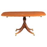 A REGENCY SATINWOOD CROSSBANDED FIGURED MAHOGANY TILT-TOP TABLE with turned column base and