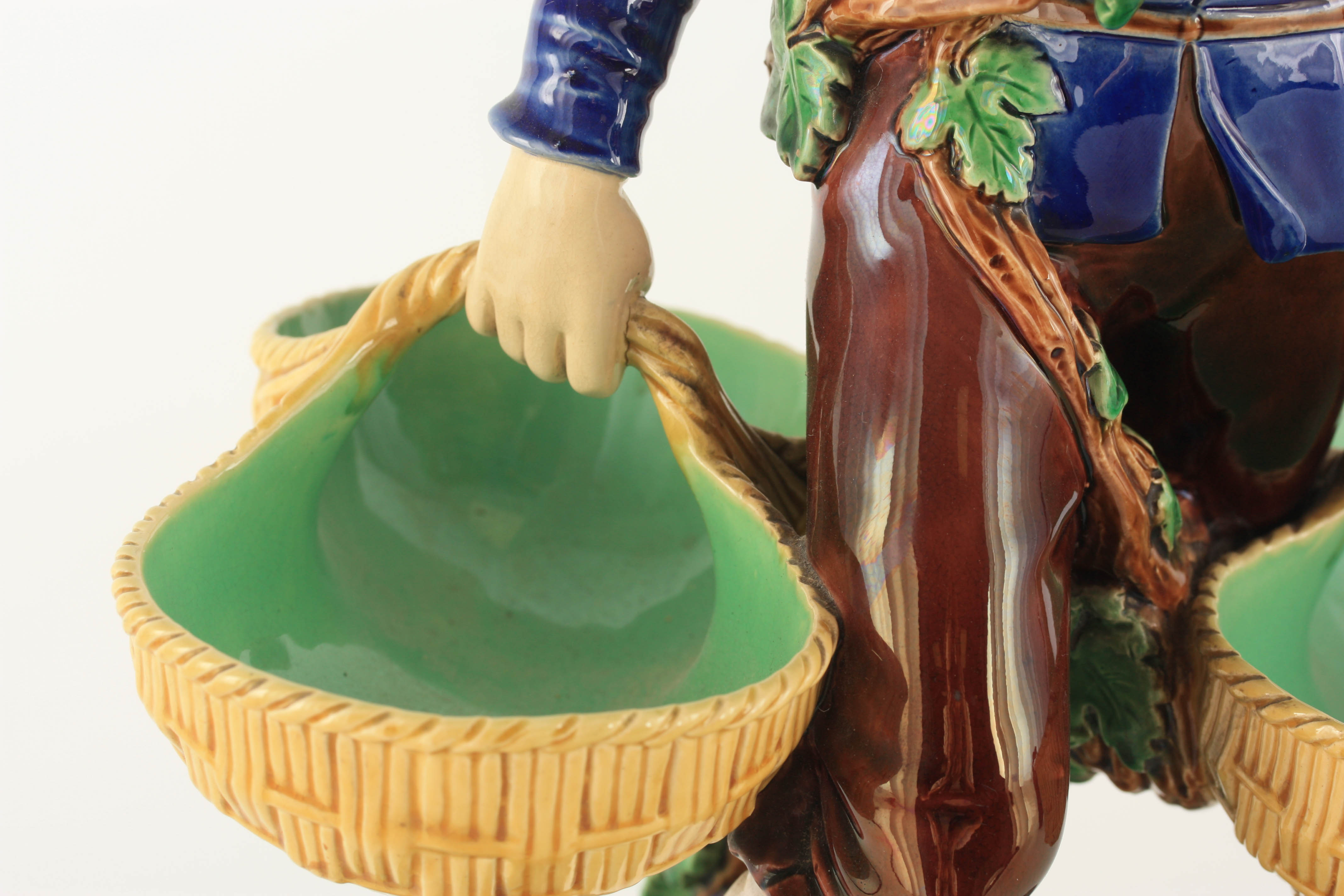 A 19TH CENTURY MINTON MAJOLICA FIGURE finely modelled as a young man carrying baskets coloured in - Image 2 of 8