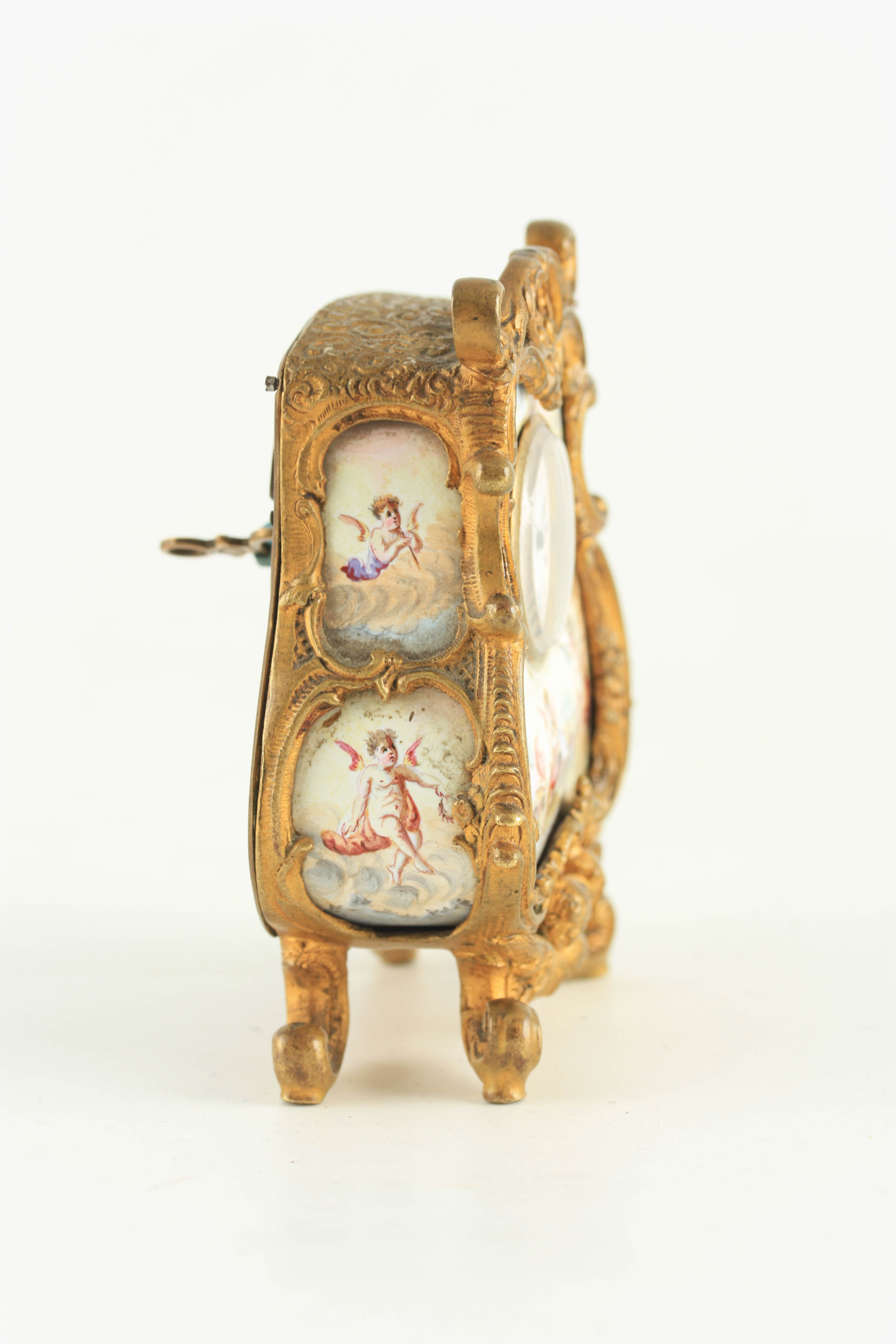 A LATE 19TH CENTURY VIENNESE ENAMEL AND GILT MOUNTED BOUDOIR CLOCK the bombe shaped case with rococo - Image 4 of 6