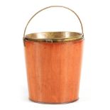 A GEORGE III MAHOGANY OYSTER BUCKET with folding handle and brass lined interior, of tapering form