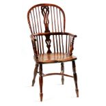 AN EARLY 19TH CENTURY NOTTINGHAMSHIRE YEW-WOOD HIGH BACK WINDSOR CHAIR with hooped top rail and