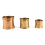 A SET OF THREE CYLINDRICAL GILT BRONZE QUART, PINT, AND HALF PINT DAIRY MEASURES for the "Express