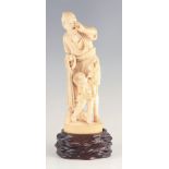 A LARGE JAPANESE MEIJI PERIOD IVORY OKIMONO modelled as a fisherman calling out and a young boy with