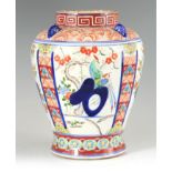 AN 18TH CENTURY JAPANESE IMARI VASE painted panels to the body decorated with exotic birds on