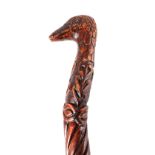 A 19TH CENTURY CARVED FOLK ART WALKING STICK having a duck head handle above figures, snake,
