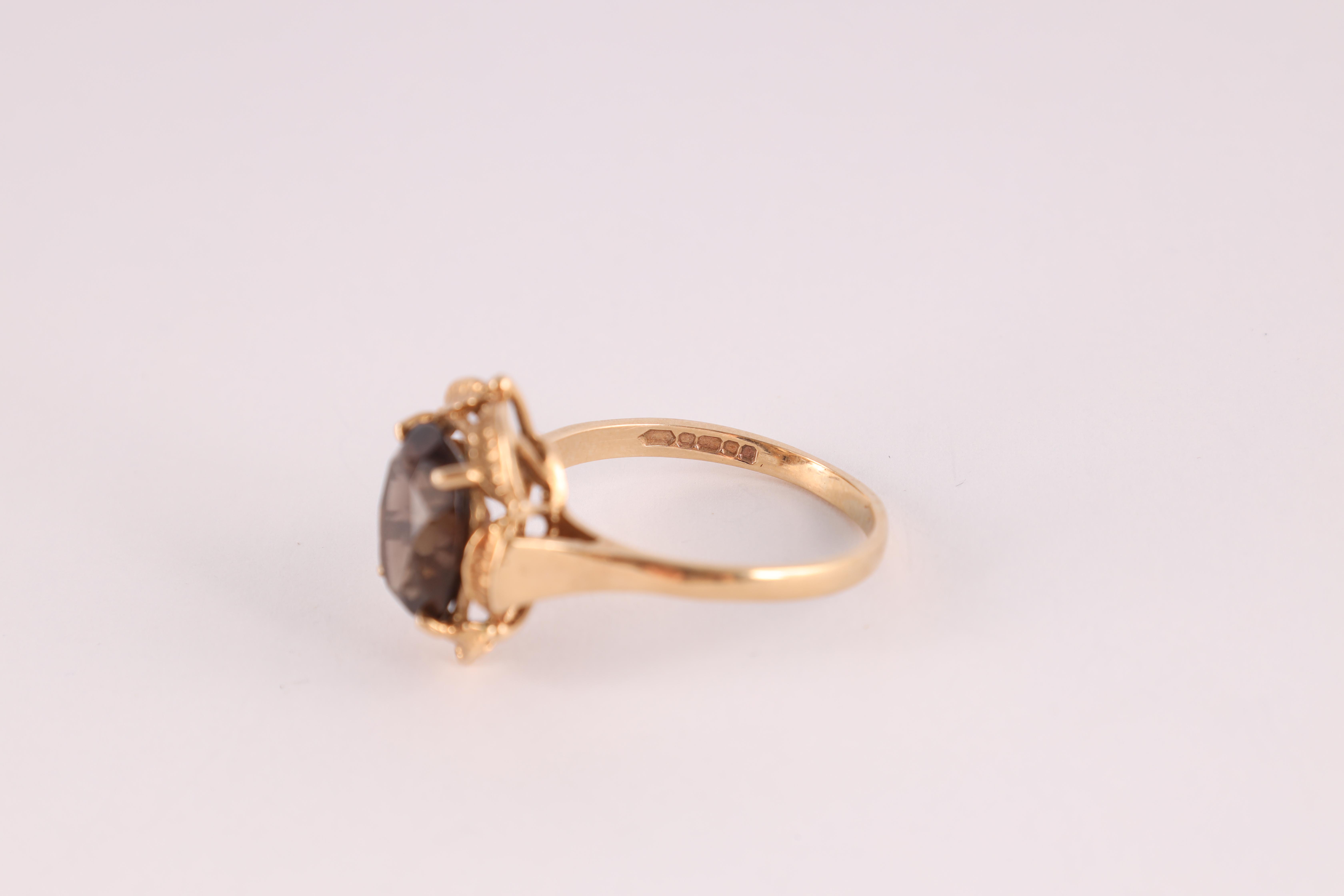 A LADIES 9CT GOLD SMOKEY QUARTZ SOLITAIRE RING the large stone measuring 10mm wide and 12mm, app. - Image 5 of 6