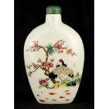 A 19TH CENTURY CHINESE FAMILLE ROSE SNUFF BOTTLE decorated with birds under blossoming trees, having