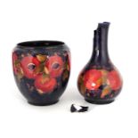 AN EARLY MOORCROFT BURSLEM LARGE OVOID VASE tube lined and decorated in the Pomegranate pattern on a