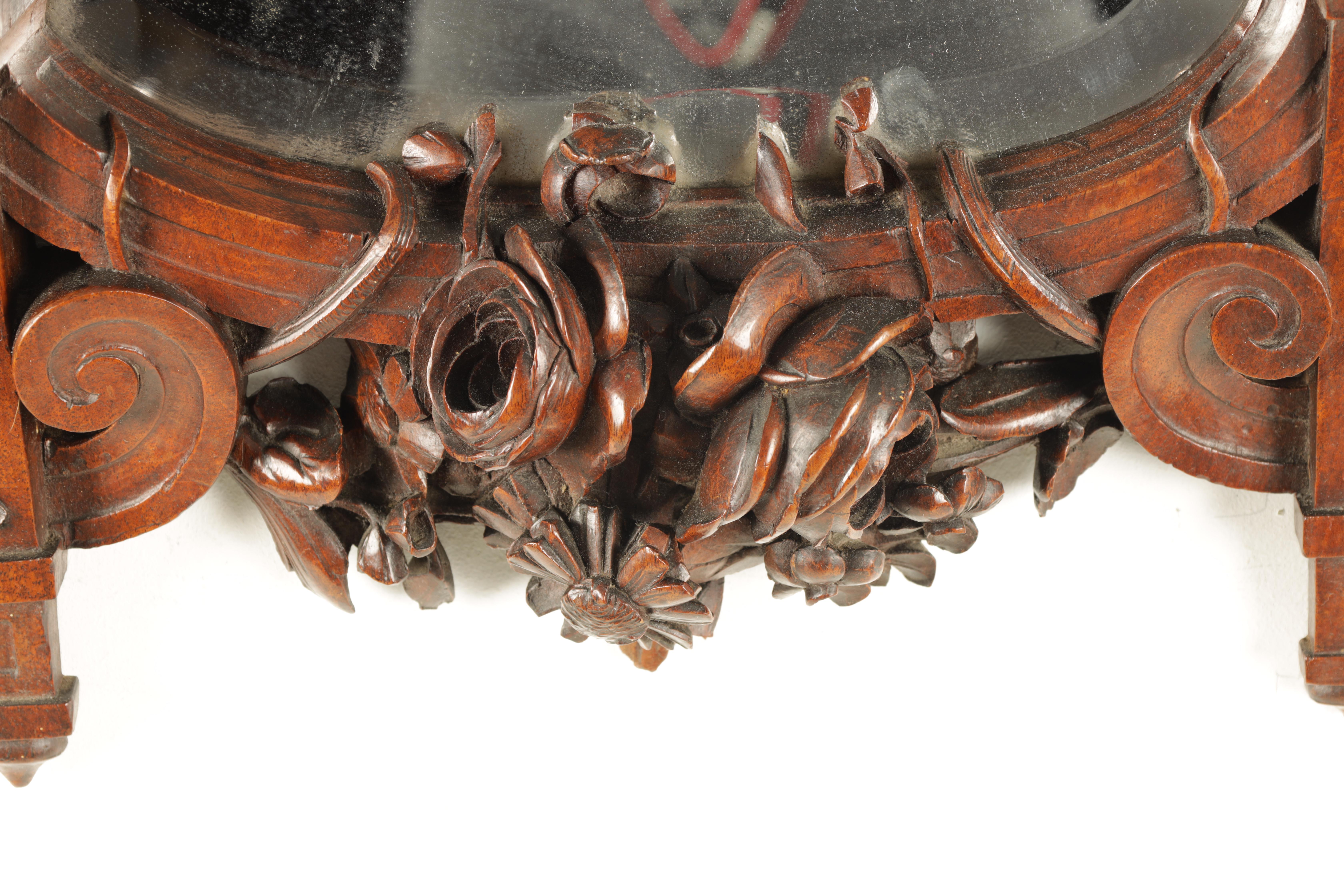 A 19TH CENTURY WALNUT BLACK FOREST CARVED HANGING MIRROR with a pair of doves to the top and a - Image 3 of 5