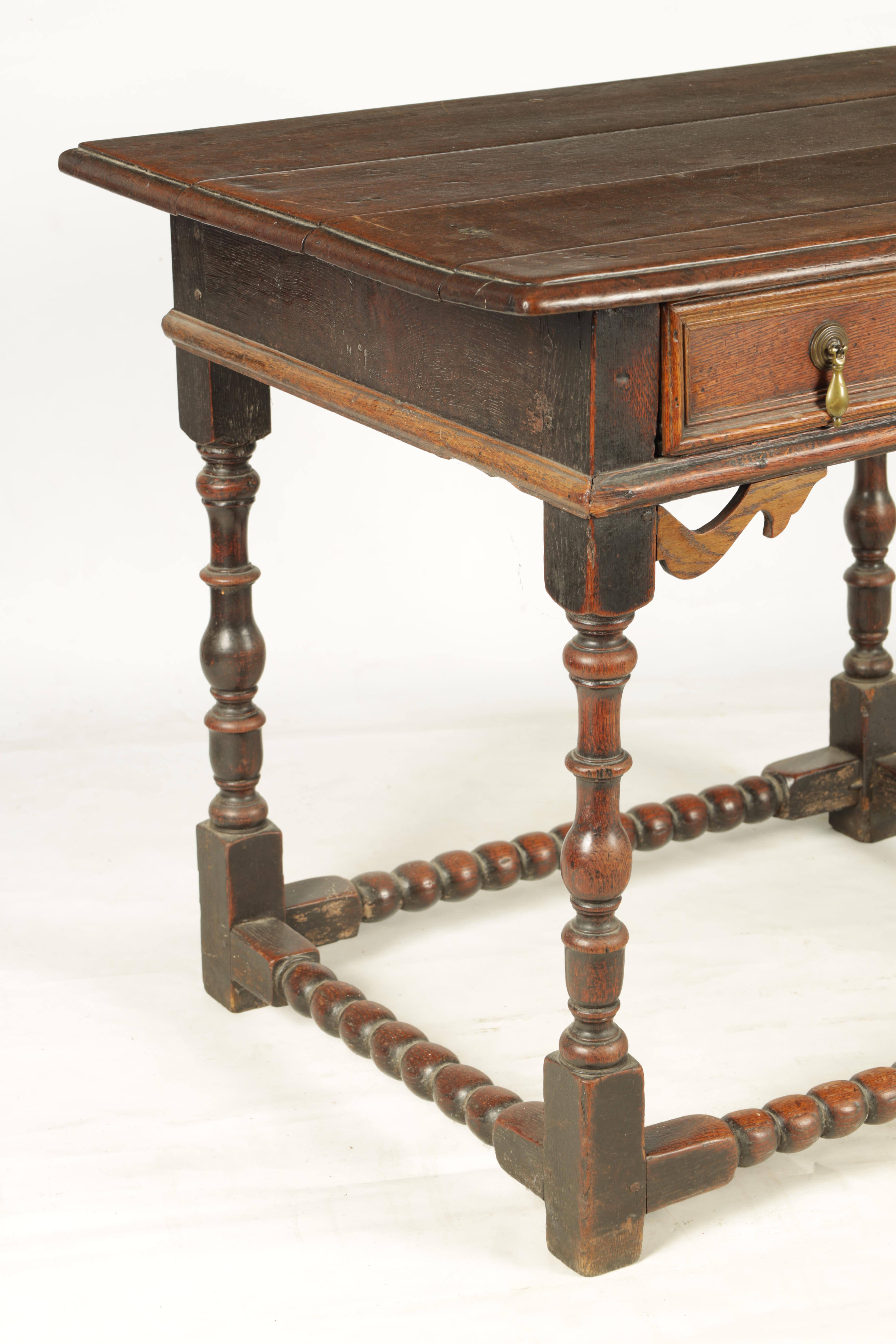 A 17TH CENTURY JOINED OAK SIDE TABLE with panelled frieze drawer and shaped pierced corner blocks; - Image 7 of 8