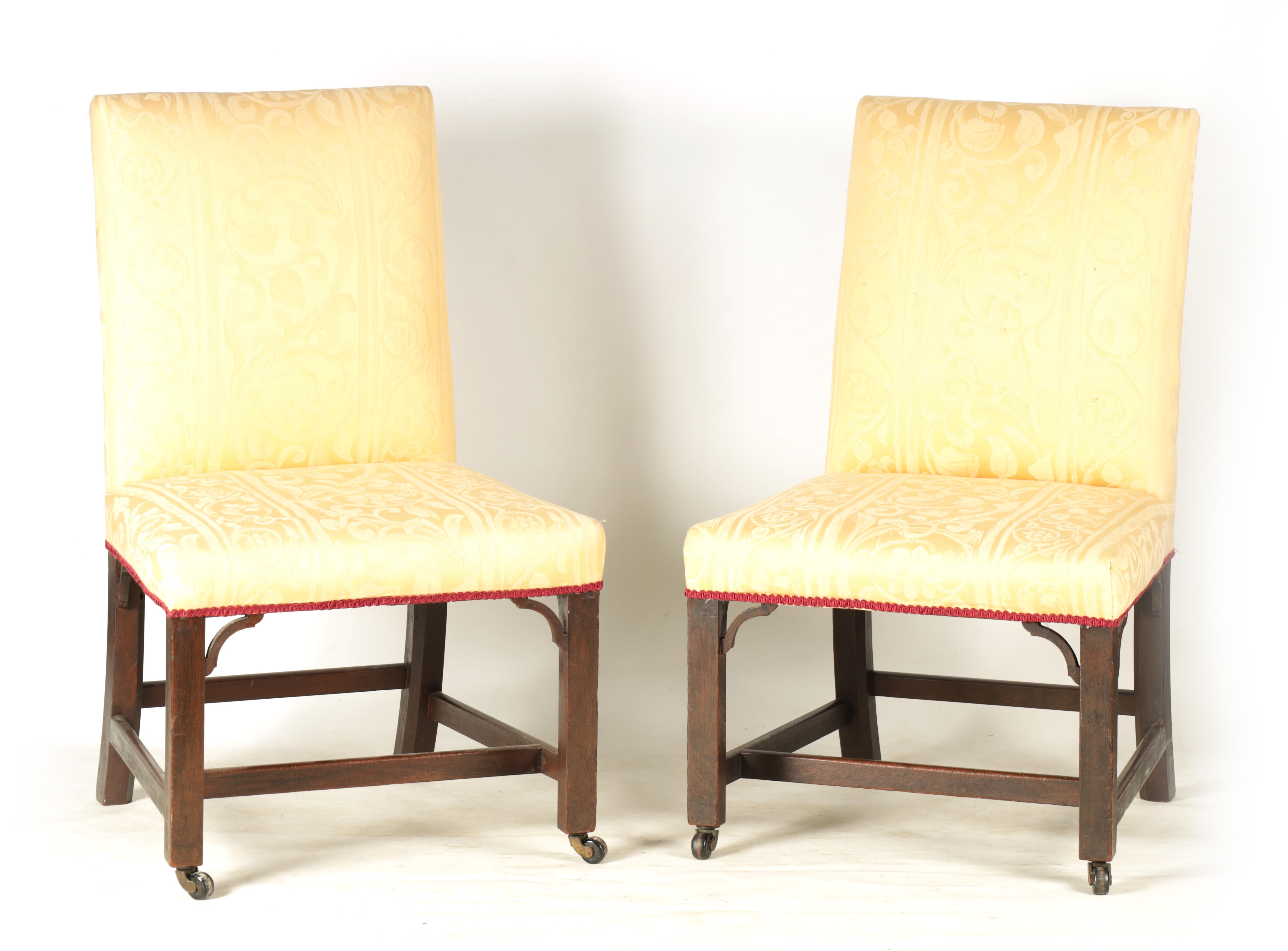 A PAIR OF GEORGE III MAHOGANY CHIPPENDALE STYLE UPHOLSTERED SIDE CHAIRS with square-shaped backs
